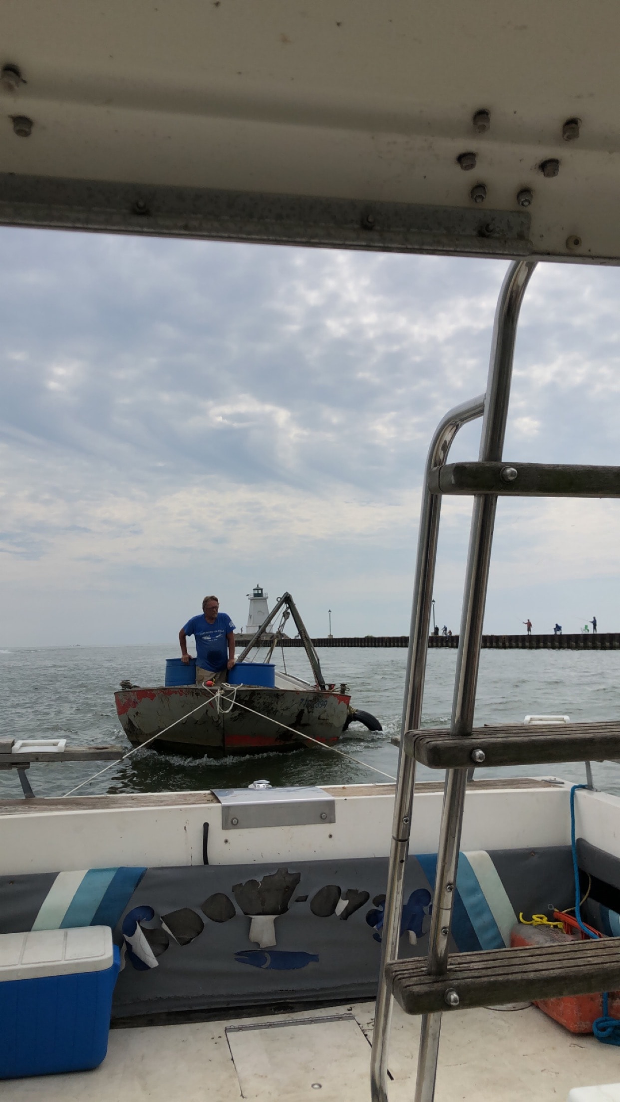 Powers Marine workboat near lighthouse breakwall